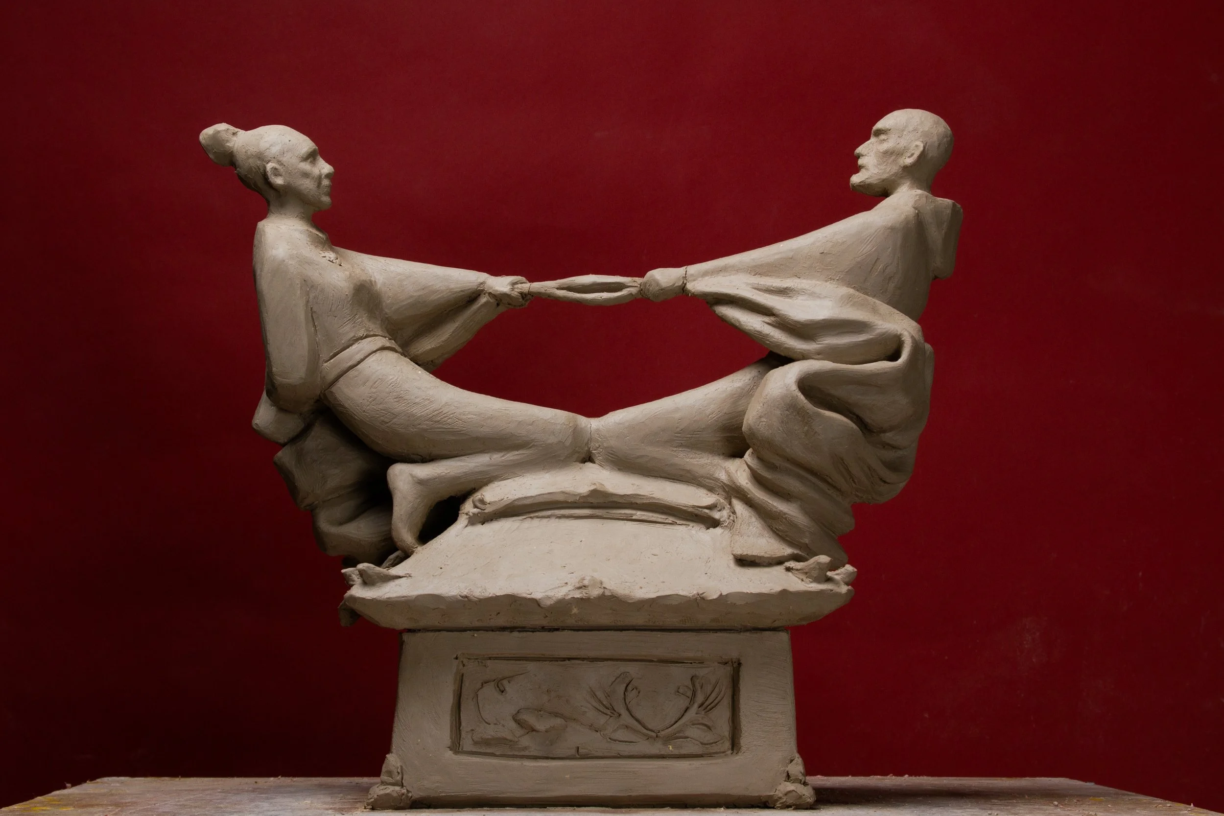 Clay maquette of two seated figures
